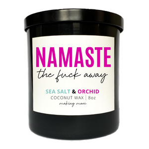 8 oz coconut wax candle in a black glass jar. White label that says namaste the fuck away. Fragrance is sea salt and orchid.